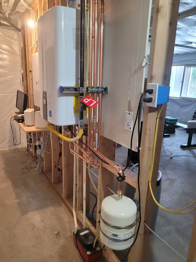 Licensed plumber repairing a kitchen sink in Westport